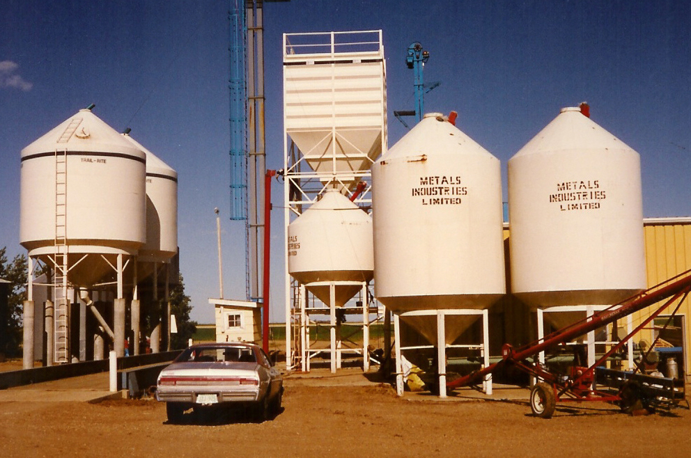 Old Photo of first bins and buildings of the Seed Cleaning Plant